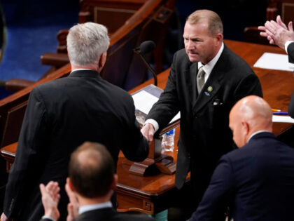 Rep. Troy Nehls, R-Texas, shakes hands with Rep. Kevin McCarthy, R-Calif., as he nominates him for speaker ahead of the ninth round of voting in the House chamber as the House meets for the third day to elect a speaker and convene the 118th Congress in Washington, Thursday, Jan. 5, …