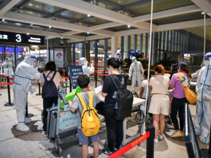 HAIKOU, CHINA - AUGUST 11: Staff members check tourists' health and nucleic acid testing information at the Haikou Meilan International Airport on August 11, 2022 in Haikou, Hainan Province of China. The first batch of 660 stranded tourists due to the latest COVID-19 resurgence returned to home on the early …