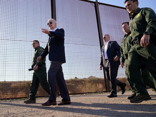 FILE - President Joe Biden walks along a stretch of the U.S.-Mexico border in El Paso Texa