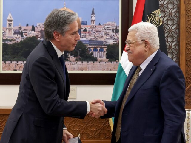 TOPSHOT - Palestinian President Mahmud Abbas (R) and US Secretary of State Antony Blinken shake hands following their meeting in Ramallah in the occupied West Bank, on January 31, 2023. (Photo by RONALDO SCHEMIDT / POOL / AFP) (Photo by RONALDO SCHEMIDT/POOL/AFP via Getty Images)