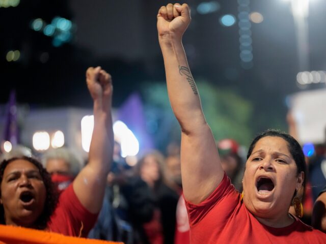 Demonstrators shout slogans against Brazilian former President Jair Bolsonaro during a pro