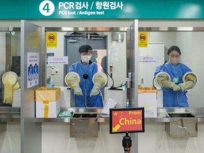 INCHEON, SOUTH KOREA - 2023/01/02: Quarantine officials seen preparing for a PCR test for travelers arriving from China in COVID-19 testing station at Incheon International Airport, west of Seoul. South Korea started requiring COVID-19 testing for arrivals from China at Incheon International Airport, the gateway to South Korea. (Photo by …