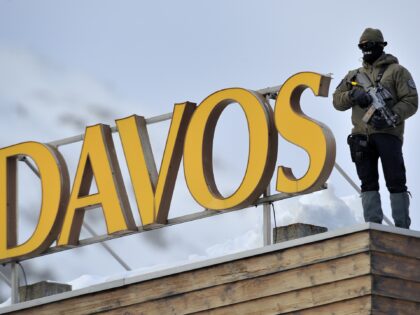 A sniper stands on the roof of the Congress Center on January 25, 2011 on the eve of the World Economic Forum annual meeting in Davos. Switzerland has mobilized up to 5,000 soldiers to secure the area surrounding the alpine village of Davos, where world political and economic leaders are …