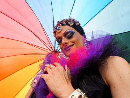 Dragqueen with makeup, jewelry and tulle outfit - stock photo