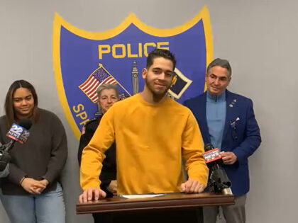 A Good Samaritan is being praised for saving the lives of two police officers during the arrest of an armed robbery suspect that almost turned deadly.