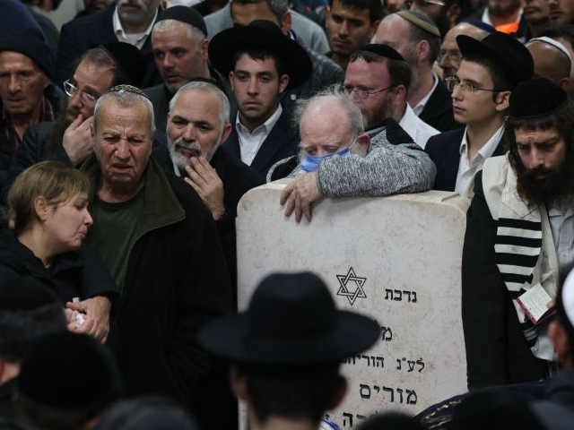 Mourners gather during the funeral of Eli Mizrahi and his wife, Natalie, who were victims of a shooting attack in East Jerusalem on January 27, 2023, in Bet Shemesh, Israel, January 28, 2023. - Israeli Prime Minister Benjamin Netanyahu vowed 