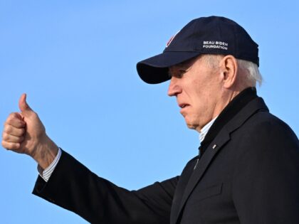 US President Joe Biden gives a thumb's up as he departs after inspecting flood damage from