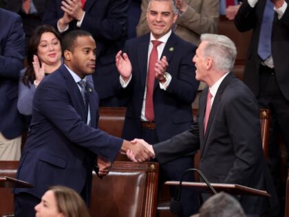 WASHINGTON, DC - JANUARY 05: U.S. House Republican Leader Kevin McCarthy (R-CA) (R) shakes hands with Rep.-elect John James (R-MI) in the House Chamber during the third day of elections for Speaker of the House at the U.S. Capitol Building on January 05, 2023 in Washington, DC. The House of …