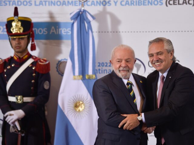 Brazil's President Luiz Inacio Lula da Silva, center, and Argentina's President Alberto Fernandez pose for photos during the Community of Latin American and Caribbean States (CELAC) Summit in Buenos Aires, Argentina, Tuesday, Jan. 24, 2023. (AP Photo/Gustavo Garello)