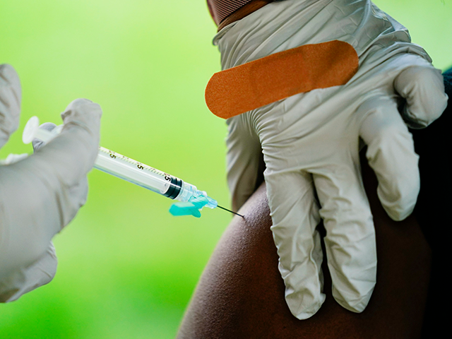A health worker administers a dose of a Pfizer COVID-19 vaccine during a vaccination clinic in Reading, Pa., Sept. 14, 2021. Pfizer asked U.S. regulators Monday, Aug. 22, 2022, to authorize its combination COVID-19 vaccine that adds protection against the newest omicron mutants — a key step toward opening a …
