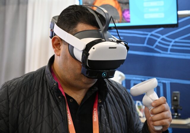 A man at CES tries out OVR Technology's ION 3, which emits smells when a user interacts wi