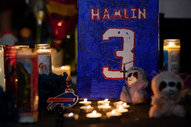 Damar Hamlin's jersey is displayed at a candlelight vigil for the Buffalo Bills safety who