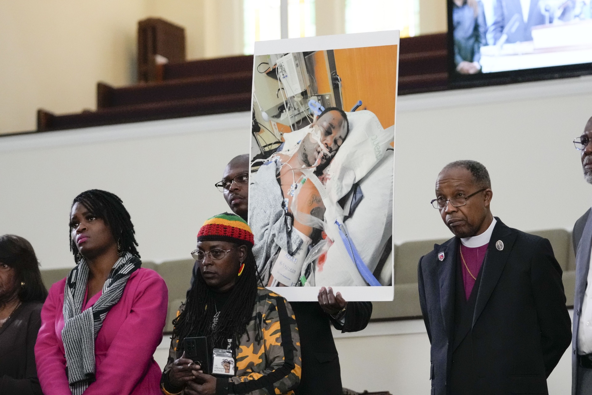 Family members and supporters hold a photograph of Tyre Nichols at a news conference in Memphis, Tenn., Jan. 23, 2023. The U.S. Attorney’s Office said Wednesday, Jan. 25, 2023 the federal investigation into the death of a Black man who died after a violent arrest by Memphis police “may take some time.” Speaking during a news conference, U.S. Attorney Kevin G. Ritz said his office is working with the Justice Department's Civil Rights Division in Washington as it investigates the case of Tyre Nichols, who died three days after his Jan. 7 arrest. (AP Photo/Gerald Herbert, file)