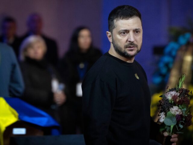 Ukrainian President Volodymyr Zelenskyy pays his respects to victims of a deadly helicopte