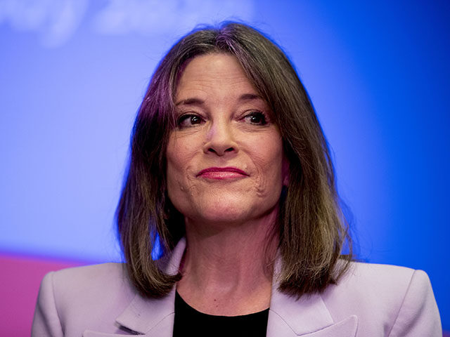 Democratic presidential candidate Marianne Williamson pauses while speaking at a the Faith