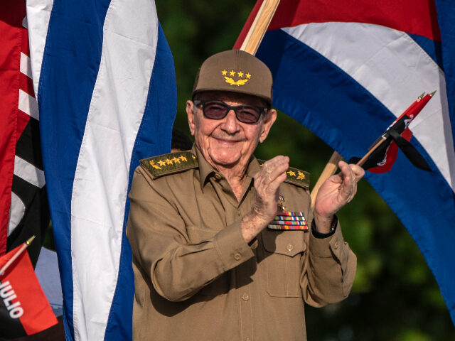 Former Cuban President Raul Castro applauds during celebration for the 69th anniversary of