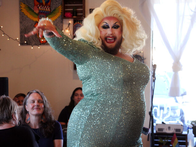 This July 28, 2022, photo shows emcee Golden Delicious performing before a mock election at Cafecito Bonito in Anchorage, Alaska, where people ranked the performances by drag performers. Several organizations are using different methods to teach Alaskans about ranked choice voting, which will be used in the upcoming special U.S. …