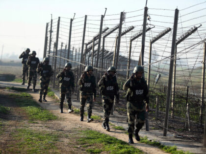 FILE- Indian Border Security Force (BSF) soldiers patrol near the India-Pakistan border fencing at Suchet Garh in Ranbir Singh Pura, Jammu and Kashmir, India, Jan. 23, 2020. For decades, India has tried to thwart Pakistan in a protracted dispute over Kashmir. But in the last two years, policy makers in …