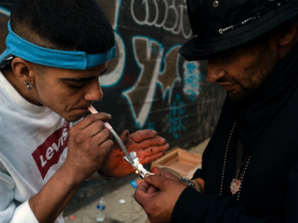 Two homeless addicts share a small piece of fentanyl in an alley in Los Angeles, Thursday, Aug. 18, 2022. Use of fentanyl, a powerful synthetic opioid that is cheap to produce and is often sold as is or laced in other drugs, has exploded. Two-thirds of the 107,000 overdose deaths …