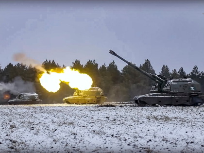 In this handout photo taken from video and released by Russian Defense Ministry Press Service on Friday, Jan. 13, 2023, Russian self-propelled 152.4 mm howitzers Msta fire on a mission at an undisclosed location in Ukraine. (Russian Defense Ministry Press Service via AP)