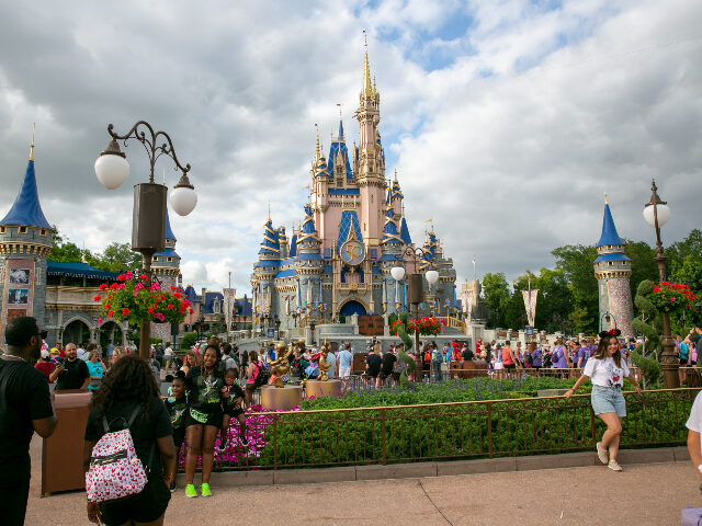 FILE - People visit Magic Kingdom Park at Walt Disney World Resort in Lake Buena Vista, Florida, on Friday, April 22, 2022. Florida lawmakers are meeting to complete a state takeover of Walt Disney World’s self-governing district and expand a migrant relocation program. The GOP-controlled Legislature is returning to Tallahassee …