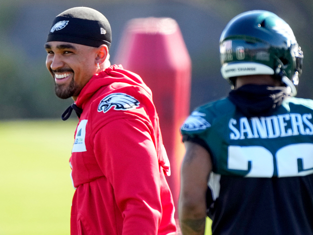 Philadelphia Eagles quarterback Jalen Hurts, left, smiles during workouts during an NFL football Super Bowl team practice, Wednesday, Feb. 8, 2023, in Tempe, Ariz. The Eagles will face the Kansas City Chiefs in Super Bowl 57 Sunday. (AP Photo/Matt York)