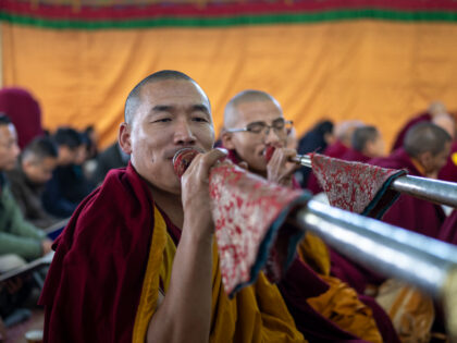 Exile Tibetan Buddhist monks blow ceremonial horns during an early morning prayer session to usher in the Year of the Water Hare in Dharamshala, India, Tuesday, Feb. 21, 2023. (AP Photo/Ashwini Bhatia)