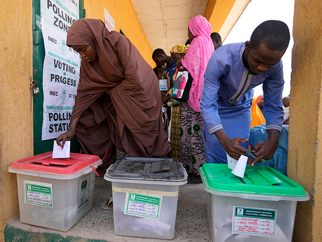 People cast their votes during the presidential elections in Yola, Nigeria, Saturday, Feb.