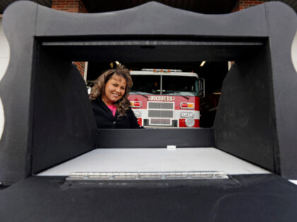 Monica Kelsey, firefighter and medic who is president of Safe Haven Baby Boxes Inc., poses with a prototype of a baby box, where parents could surrender their newborns anonymously, outside her fire station on Feb. 26, 2015, in Woodburn, Ind. Kentucky has seen its first infant anonymously dropped off at …