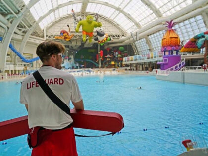 A lifeguard keeps watch over a gigantic pool at the Dreamworks Water Park inside the American Dream Mall, Thursday, Oct. 1, 2020, in East Rutherford, New Jersey. The attraction and shopping megamall reopened to the public on Thursday after it was forced to shutter it's doors in mid-March due to …