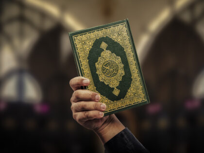 Koran in hand - holy book of Muslims( public item of all muslims )Koran in hand muslims .