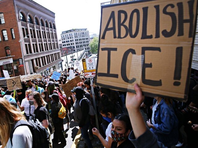 SEATTLE, WA - JULY 12: Protesters call for the abolishment of U.S. Immigration and Customs