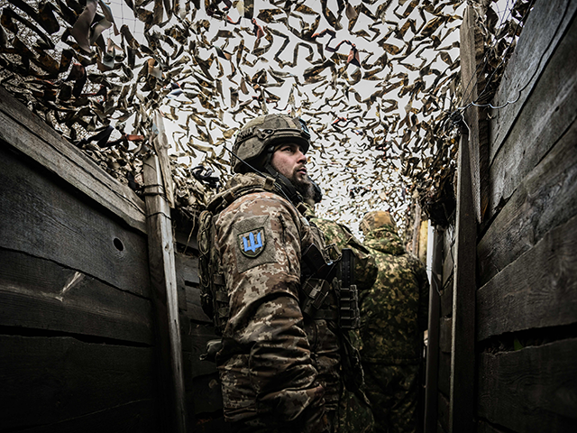 Ukrainian troops patrol at the frontline outside the town of Novoluhanske, eastern Ukraine