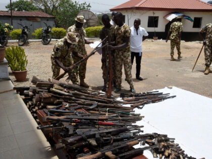 Nigerian soldiers make an inventory on April 21, 2022 of small arms and light weapons recovered from bandits during Operation Safe Haven and during the military mop up in Jos and surrounding areas in Plateau State in northcentral Nigeria. - The Nigerian military under the platform of Operation Safe Haven …