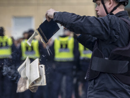 STOCKHOLM, SWEDEN - MAY 14: Rasmus Paludan burns a Koran during an election meeting in Hus