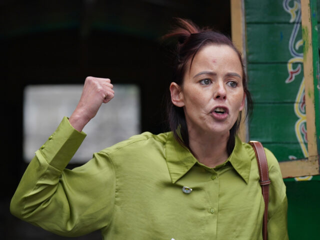 Senator Eileen Flynn addresses members of the Traveller community holding a protest outsid