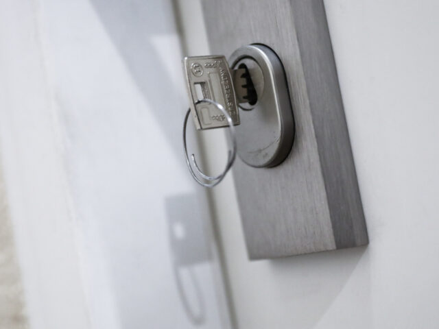 A key is seen in a lock of an apartment's door in this illustration photo taken in Kr