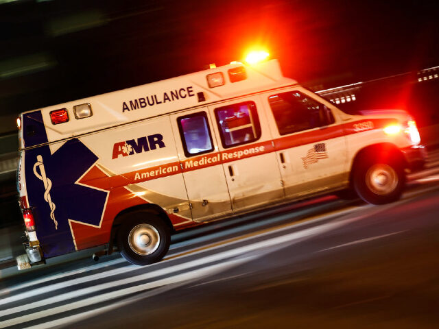 An ambulance drives the street in Washington DC on October 20, 2022. (Photo by Jakub Porzy