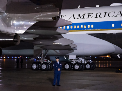 A member of the US Air Force One next to Air Force One at Joint Base Andrews in Maryland,