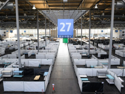 03 January 2023, Lower Saxony, Hanover: Beds for refugees are located in the field office of the State Reception Office of Lower Saxony in Exhibition Hall 27 of the Hanover Trade Fair. Photo: Julian Stratenschulte/dpa (Photo by Julian Stratenschulte/picture alliance via Getty Images)