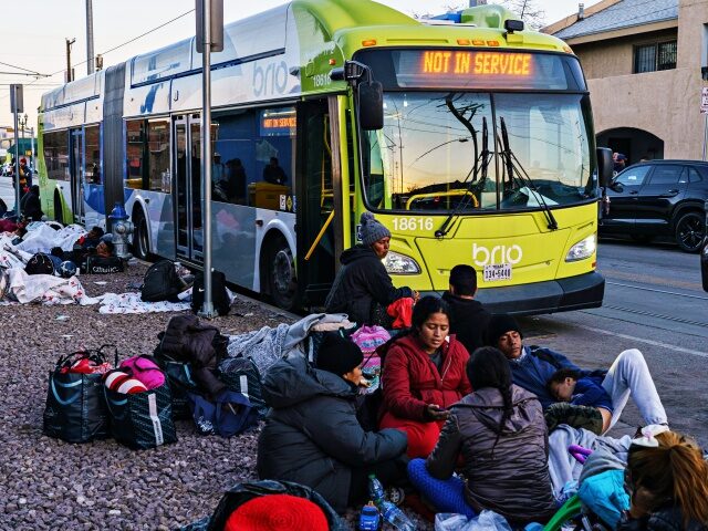 Migrants outside of Sacred Heart Church in El Paso, Texas, US, on Sunday, Jan. 8, 2023. President Joe Biden was confronted at the airport in El Paso on Sunday by Texas Governor Greg Abbott, who demanded in a hand-delivered letter that Biden act immediately to stop unauthorized immigration including by building more walls …
