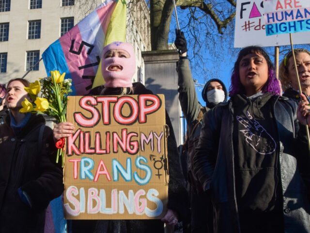 LONDON, UNITED KINGDOM - 2023/01/21: A protester holds a placard which states 'Stop killing my trans siblings' during the demonstration. Protesters gathered outside Downing Street in support of trans rights after UK Prime Minister Rishi Sunak blocked Scotlands gender recognition reforms. (Photo by Vuk Valcic/SOPA Images/LightRocket via Getty Images)
