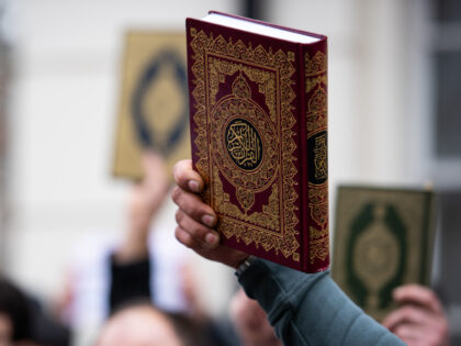 LONDON, UNITED KINGDOM - 2023/01/28: A protestor holds the Quran during the demonstration