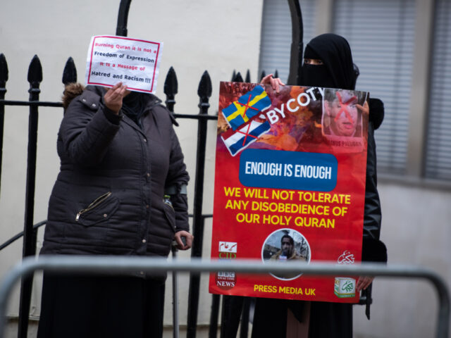 LONDON, UNITED KINGDOM - 2023/01/28: Protestors hold placards during the demonstration aga