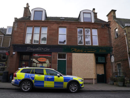 A police car parked outside Millers of Melrose, a family butchers shop which has been boarded up in Melrose, in the Scottish Borders, as police continue their investigation into a 53-year-old man who has been charged in connection with the disappearance of an 11-year-old girl from Galashiels. Picture date: Wednesday …