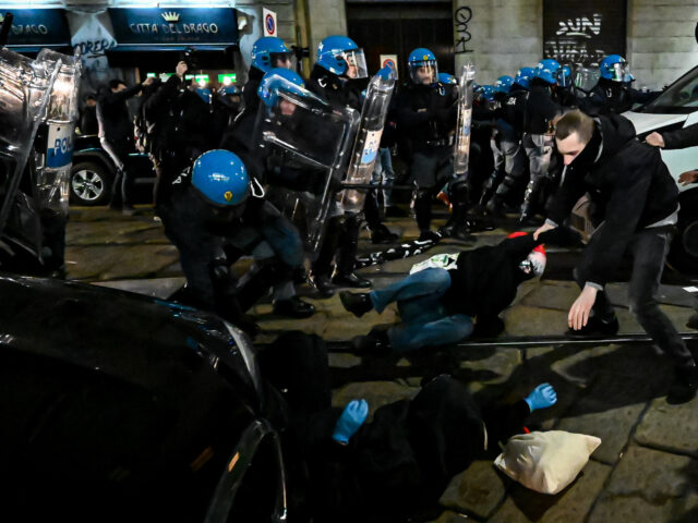 MILAN, ITALY - FEBRUARY 11: Police officers take security measures as people from anarchis