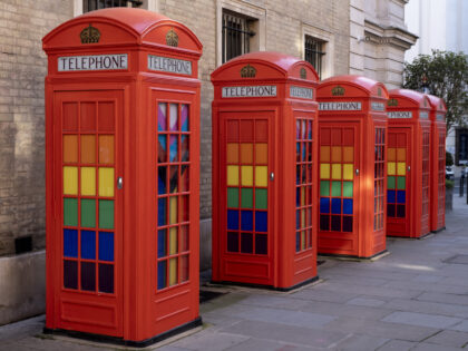 Pride Progress flags decorate the interior of red telephone boxes in Covent Garden on 7th February 2023 in London, United Kingdom. The flag includes the rainbow flag stripes to represent LGBTQ+ communities, with colors from the Transgender Pride Flag and to also represent people of colour. (photo by Mike Kemp/In …