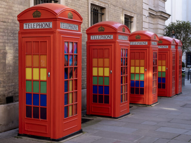 Pride Progress flags decorate the interior of red telephone boxes in Covent Garden on 7th