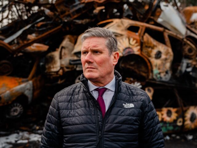 Britain's main opposition Labour Party leader Keir Starmer visits the cemetery of damaged civilian cars in the town of Irpin, near Kyiv, on February 16, 2023, amid the Russian invasion of Ukraine. (Photo by Dimitar DILKOFF / AFP) (Photo by DIMITAR DILKOFF/AFP via Getty Images)