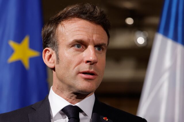 French President Emmanuel Macron makes a statement with Poland's President Andrzej Duda an